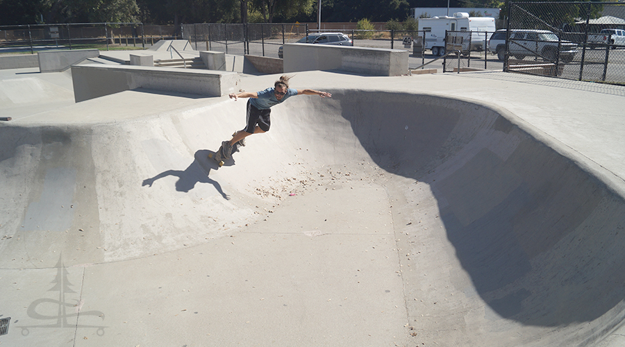 longboarding in a skatepark banked turn