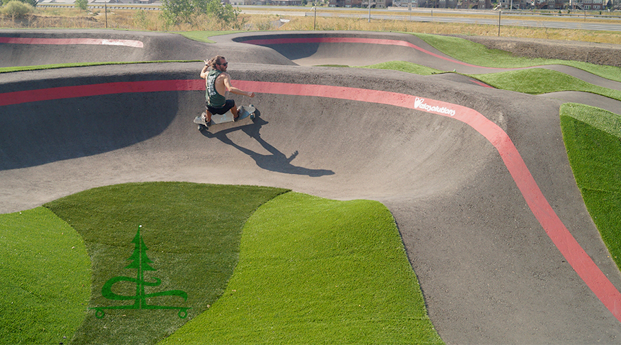 riding through a smooth turn at the pump track