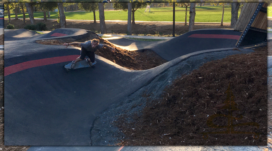 longboarding in a pump track