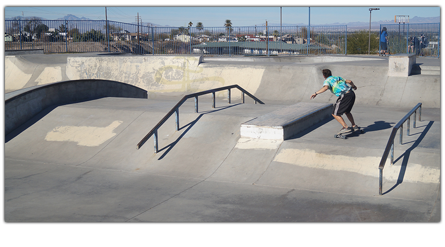 cruising the skatepark on a longboard