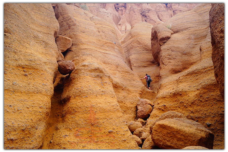 hiking red mountain trail through the vertical red rock canyons