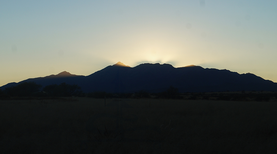 sunset over the mountains while camping near tucson
