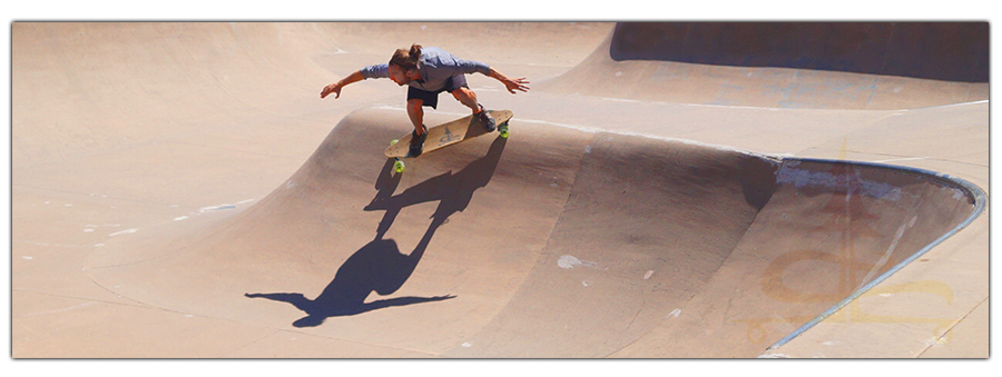 longboarding in the truckee skatepark on the rounded roll in