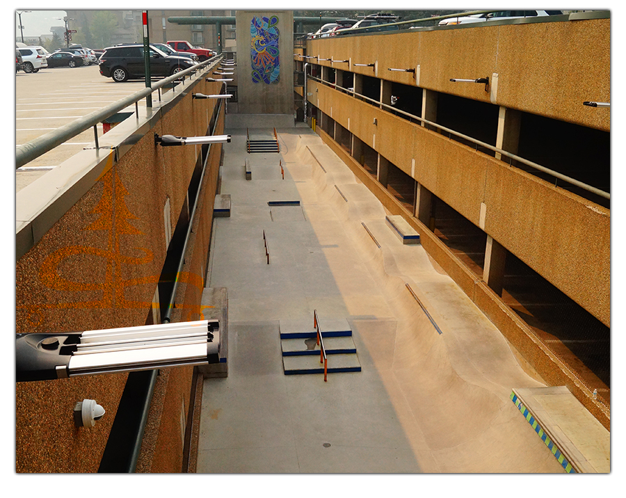 looking down at the vail skatepark from the top level of the parking garage