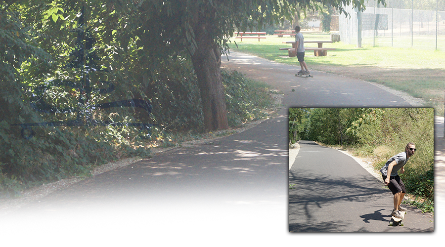 longboarding a paved path