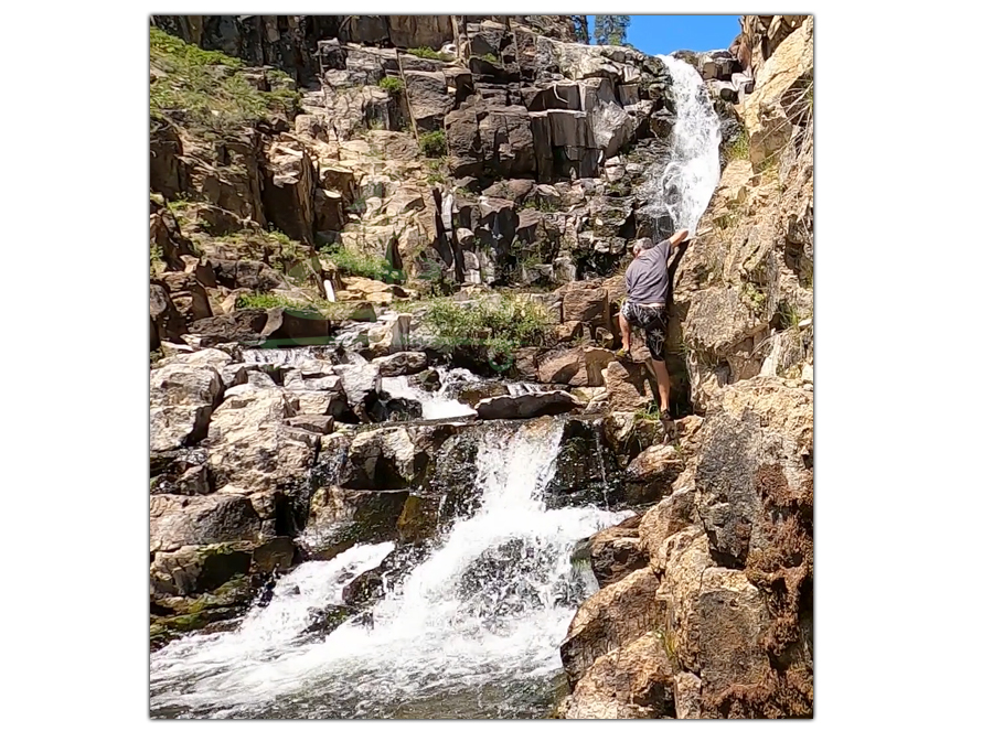 climbing around the wall by the waterfall