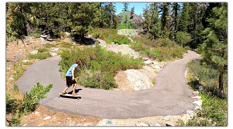 rounding a turn while longboarding fraizer falls trail