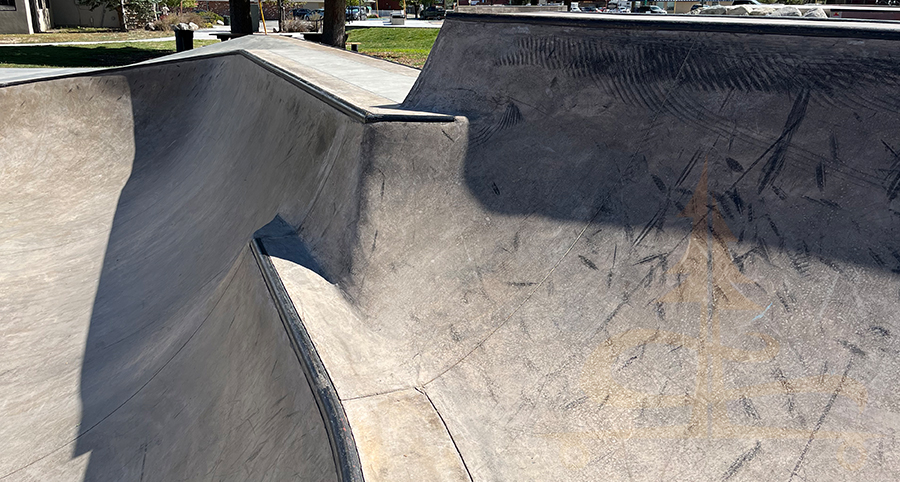 transitions on the wall in the shallow bowl at skatepark in salida