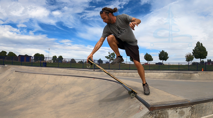 dropping in on the coping on a longboard