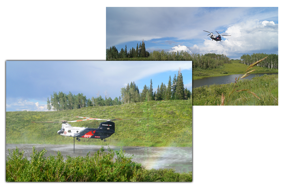 helicopters getting water from muddy pass lake to put out a fire