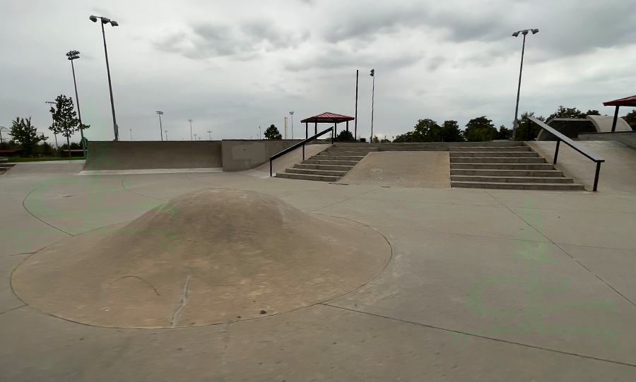 rounded hump, stairs, ramps and rails at pioneer skatepark in commerce city